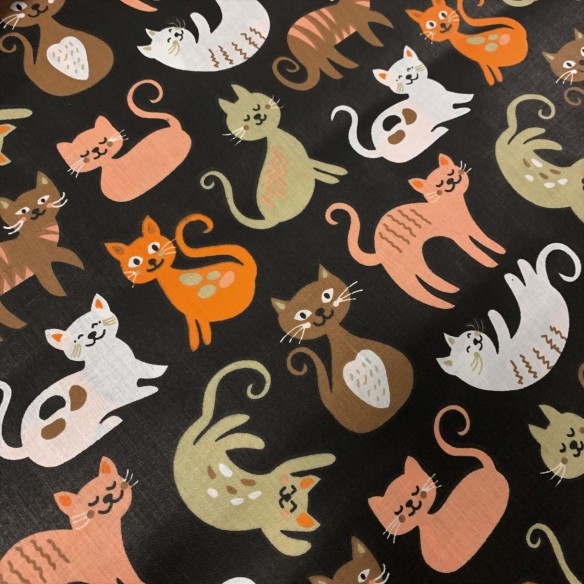 Tkanina bawełniana - Gibkie kotki na czarnym tle