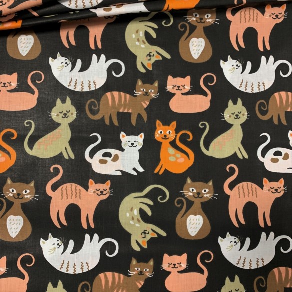 Tkanina bawełniana - Gibkie kotki na czarnym tle