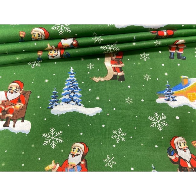 Бавовняна тканина - Зелені різдвяні будиночки та Санта Клаус